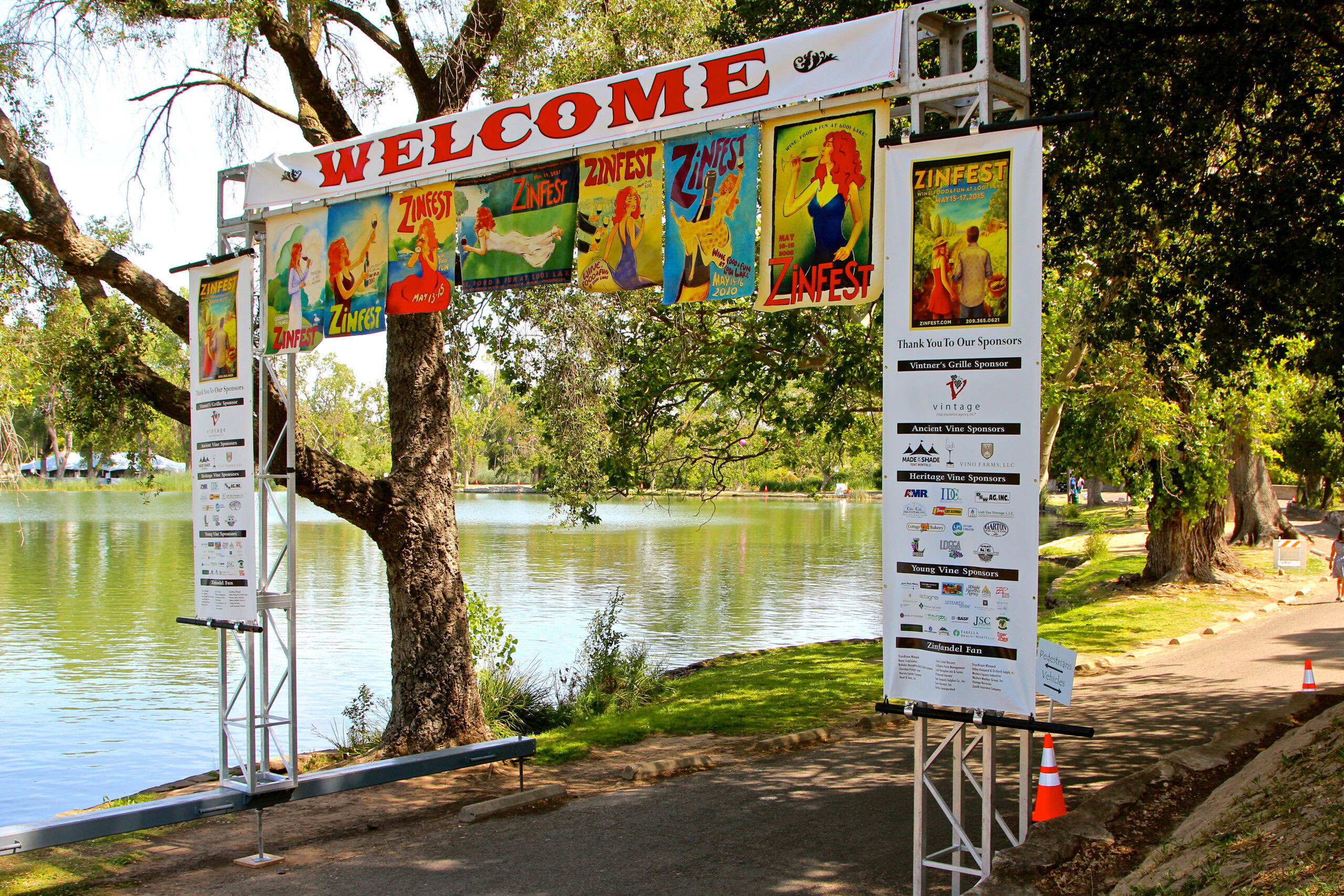 Entrance arch for the Lodi Winegrape Commission event with colorful banners and sponsor logos.