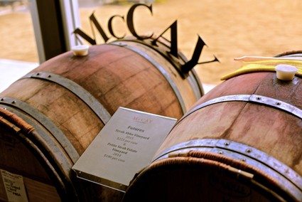 Wine barrels at Lodi Winegrape Commission showcasing wine aging process and craftsmanship.