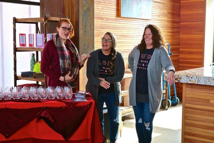 Three women enjoying a wine tasting event at Lodi Winegrape Commission.