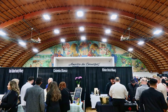 People attending a wine tasting event at the Lodi Winegrape Commission showcase.