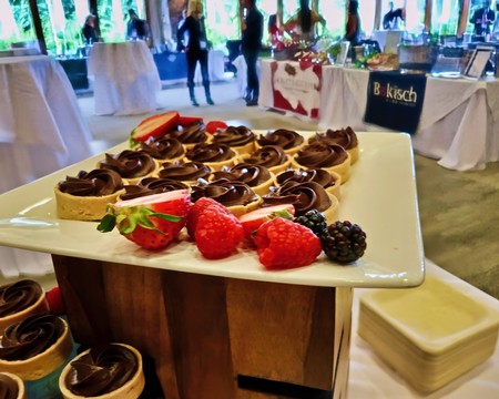 Dessert platter with chocolate tarts and fresh berries at Lodi Winegrape Commission event.