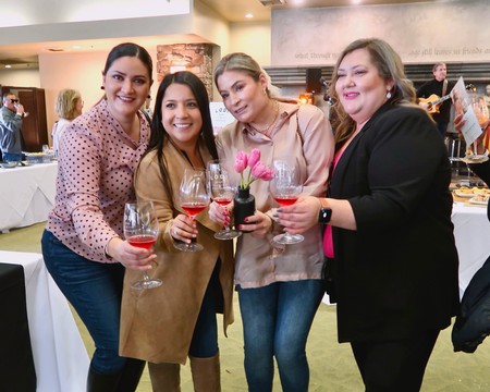 Group of women enjoying wine tasting at Lodi Winegrape Commission event.