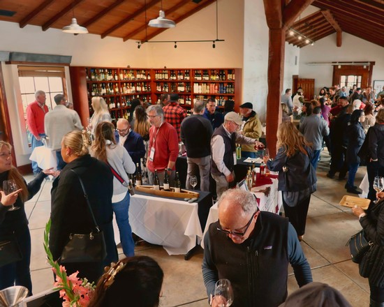Crowd of people at a wine tasting event organized by the Lodi Winegrape Commission.