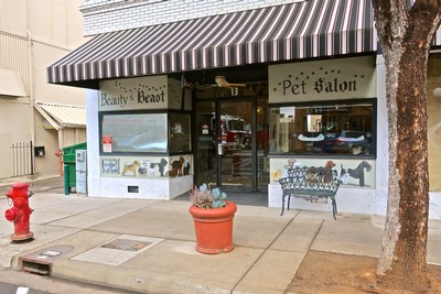 Exterior view of a storefront with pet salon and beauty boutique signage in Lodi, California.