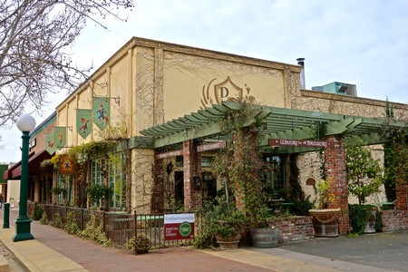 Historic building of the Lodi Winegrape Commission with vine-covered patio and vintage architecture.