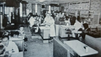 Vintage black and white photo of Lodi Winegrape Commission office with staff working at counters and desks.