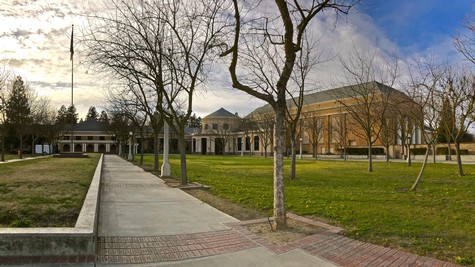 Lodi Winegrape Commission headquarters with trees and a clear sky in the background.