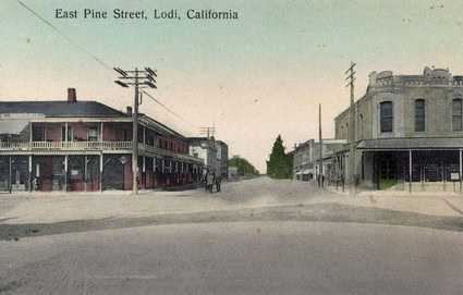 Historic East Pine Street in Lodi, California, with vintage buildings and utility poles.