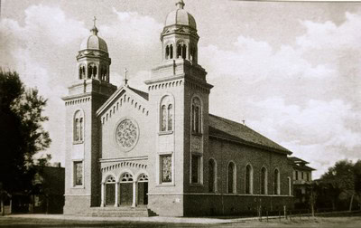 Black and white photo of the historic Lodi Winegrape Commission building with twin towers and arched entrance.
