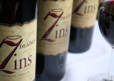 Close-up of wine bottles from the Lodi Winegrape Commission showcasing premium wine labels.