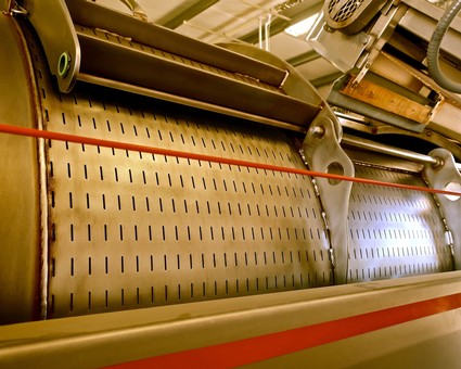 Close-up of winegrape processing machinery at Lodi Winegrape Commission facility.