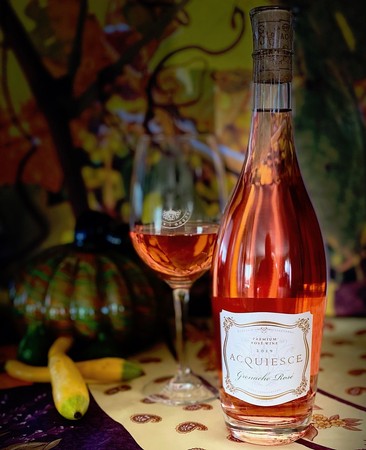 Rosé wine bottle and glass from Lodi Winegrape Commission, showcasing local wine production.