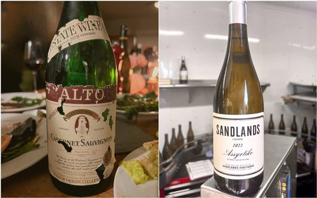 Two wine bottles from Lodi Winegrape Commission, showcasing local wines and vineyards.