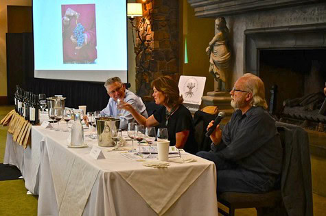 Panel discussion at Lodi Winegrape Commission event with speakers and audience members.