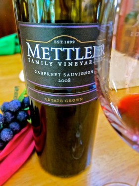 Bottle of Mettler Family Vineyards Cabernet Sauvignon 2008 wine with grapes and glass nearby.