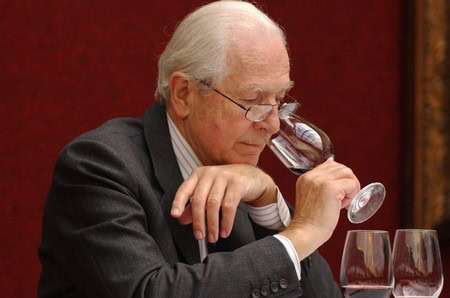 Elderly man tasting wine at Lodi Winegrape Commission event, showcasing wine industry expertise.