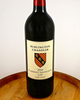 Burlington Chandler Cabernet Sauvignon 2018 wine bottle from Lodi, estate grown, on a wooden surface.