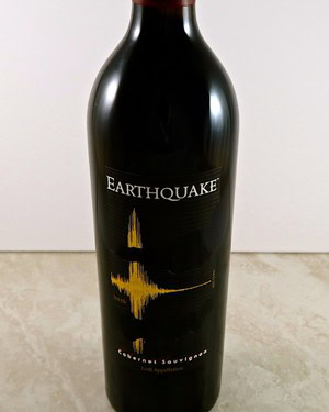 Earthquake red wine bottle with black label and gold soundwave design, from Lodi Winegrape Commission.
