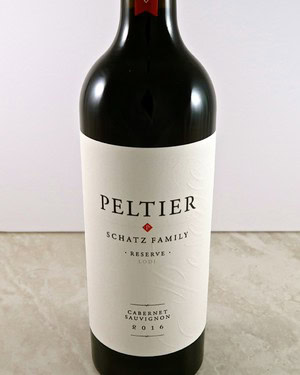 Bottle of Peltier Cabernet Sauvignon 2016 from Lodi Winegrape Commission, featuring a white label and dark glass bottle.
