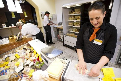 Cheese shop with staff and customers, showcasing local cheese selection in Lodi, California.