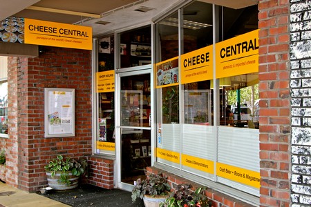 Cheese Central store with bright yellow signs and brick exterior in Lodi, California.