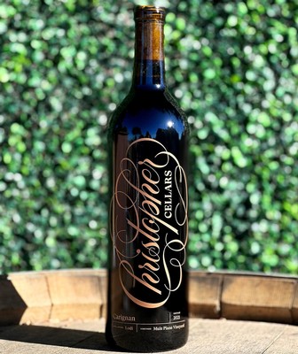 Lodi Winegrape Commission wine bottle with elegant label on a wooden surface.