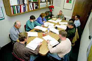 Group of professionals in a meeting discussing winegrape industry strategies at Lodi Winegrape Commission.