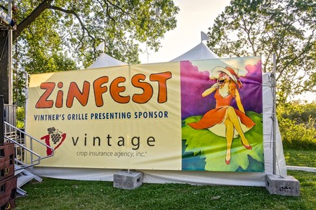Zinfest banner at Vintner's Grille showcasing wine festival sponsorship in Lodi, California.