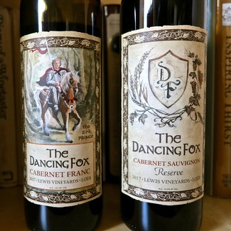 Two bottles of Cabernet Sauvignon wine from Lodi Winegrape Commission with detailed labels.