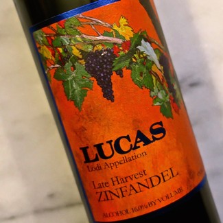 Close-up of a Lodi Zinfandel wine bottle label with grapes and vineyard imagery.