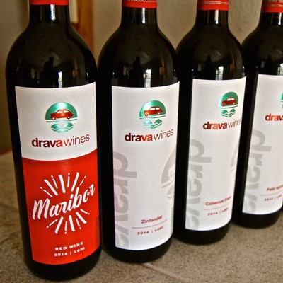 Four bottles of Lodi wine from the Lodi Winegrape Commission, showcasing red wine labels and branding.