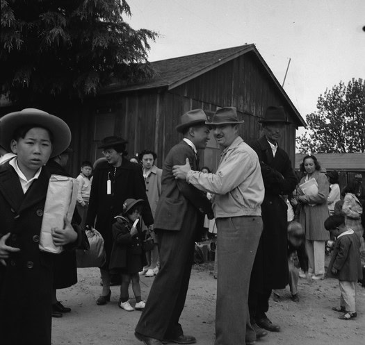 People dancing and socializing outdoors at a historic event in Lodi, California.