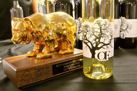 Golden pig award and wine bottles from Lodi Winegrape Commission showcase.
