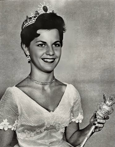 Black and white portrait of Miss America 1954 wearing a crown and holding a scepter.