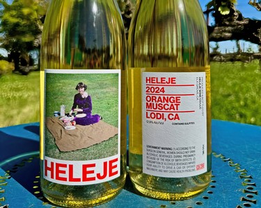 Close-up of Heleje Orange Muscat wine bottle with label, outdoors on a sunny day in Lodi, California.