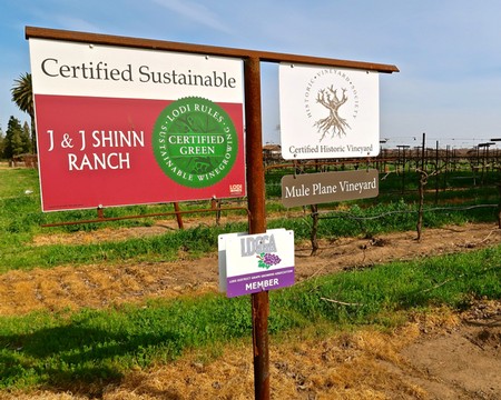 Vineyard signs showing certified sustainable and green practices at Lodi Winegrape Commission.