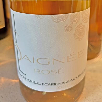 Close-up of a rosé wine bottle label from Lodi Winegrape Commission, showcasing elegant design and branding.