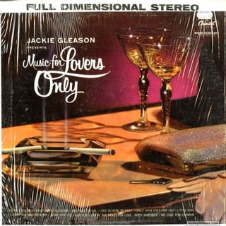 Vintage album cover for Jackie Gleason's 'Music for Lovers Only' featuring two wine glasses and a cigar on a wooden surface.