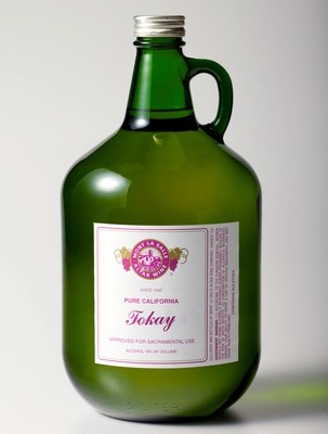Green glass bottle with a handle and pink label from Lodi Winegrape Commission, California wine industry.