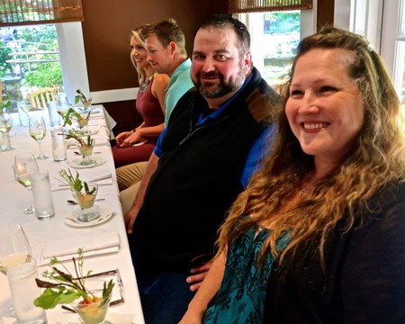 Group of people enjoying a wine tasting event at a restaurant in Lodi, California.