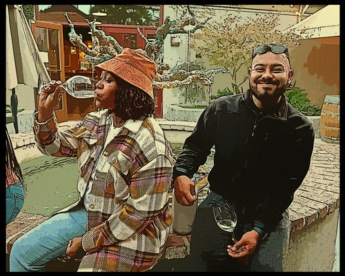 Two people enjoying wine tasting outdoors, one woman drinking from a glass, one man smiling with a glass in hand.
