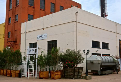 Lodi Winegrape Commission office building with outdoor seating and greenery in Lodi, California.