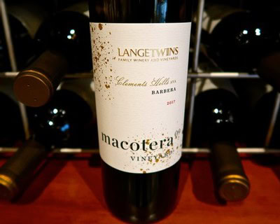 Close-up of a 2017 Macotera wine bottle from Lodi Winegrape Commission, showcasing elegant label design.