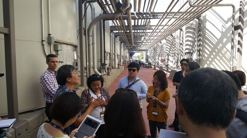 Group of people touring a wine production facility at Lodi Winegrape Commission.