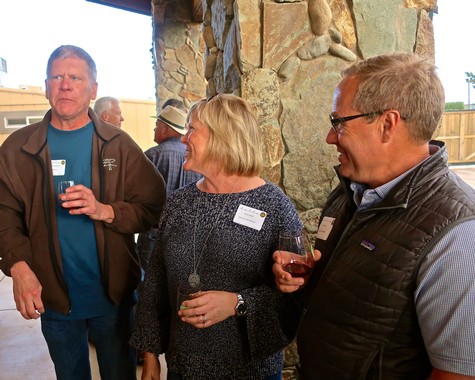 Group of people at Lodi Winegrape Commission event enjoying wine and conversation.