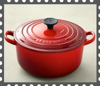 Red Le Creuset Dutch oven with lid, ideal for cooking wine-related recipes in Lodi, California.