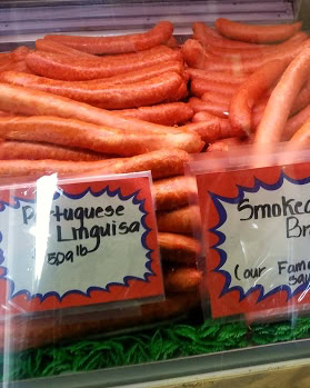 Fresh pork sausages displayed at Lodi Winegrape Commission event for local wine and food pairing.
