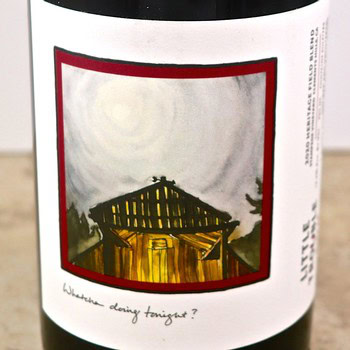 Close-up of a wine bottle label featuring a barn illustration for Lodi Winegrape Commission.