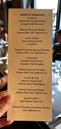 Menu and pairings from Lodi Winegrape Commission featuring cheeses, seafood, and duck confit.