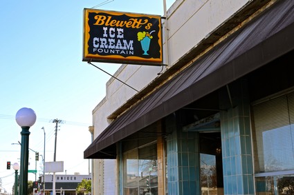 Sign for Bluewet's Ice Cream Fountain on building exterior in Lodi, California.